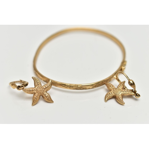 43 - A 9CT GOLD BANGLE AND A PAIR OF EARRINGS, the thin bangle decorated with a floral pattern, integrate... 