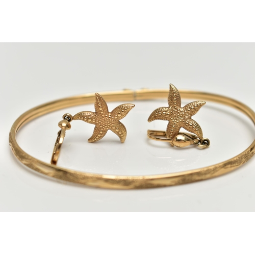 43 - A 9CT GOLD BANGLE AND A PAIR OF EARRINGS, the thin bangle decorated with a floral pattern, integrate... 