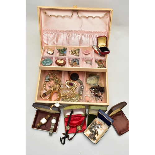 69 - A CREAM JEWELLERY BOX WITH CONTENTS, to include a white metal butterfly wing pendant stamped 'Sterli... 