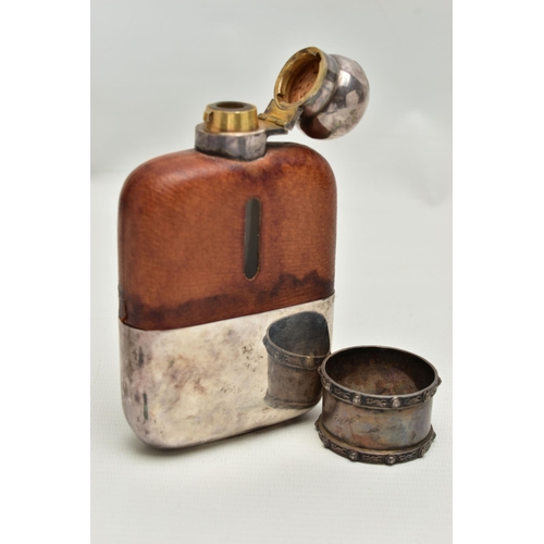 86 - A HIPFLASK AND A SILVER NAPKIN RING, the EPBM 1/4 Pt, glass hipflask with cup, engraved 'Niall From ... 