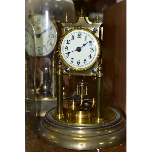 430 - TWO BRASS ANNIVERSARY CLOCKS, comprising one with a glass dome mechanism marked 72632, with key (gla... 