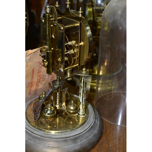 430 - TWO BRASS ANNIVERSARY CLOCKS, comprising one with a glass dome mechanism marked 72632, with key (gla... 