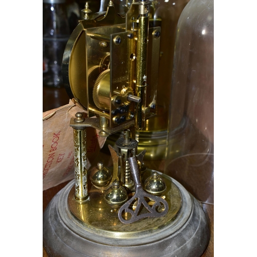 430 - TWO BRASS ANNIVERSARY CLOCKS, comprising one with a glass dome mechanism marked 72632, with key (gla... 