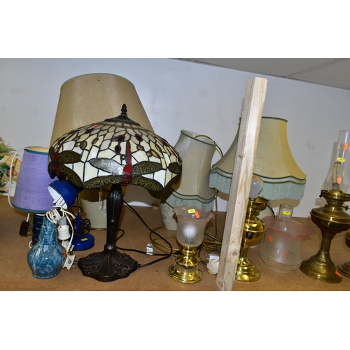 457 - ELEVEN ASSORTED TABLE LAMPS AND BRASS OIL LAMPS, including a reproduction Tiffany style leaded glass... 