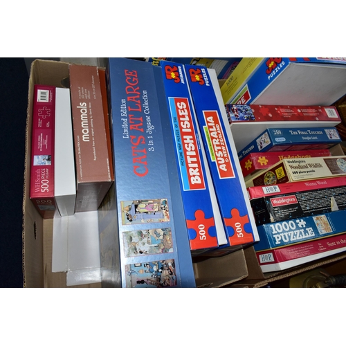570 - THREE BOXES OF JIGSAW PUZZLES, comprising twenty-four 500pc or 1000pc assorted boxed puzzles - conte... 