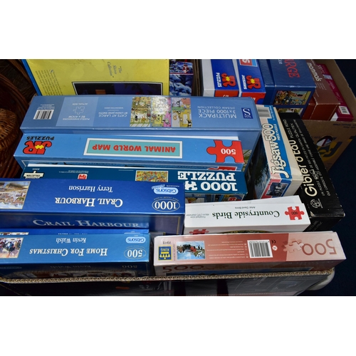 570 - THREE BOXES OF JIGSAW PUZZLES, comprising twenty-four 500pc or 1000pc assorted boxed puzzles - conte... 