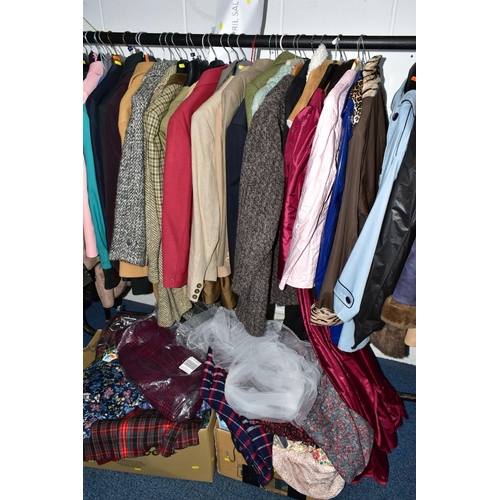 575 - A RAIL AND TWO BOXES OF LADIES CLOTHING, to include coats, jackets, faux furs, sheepskins, skirts an... 