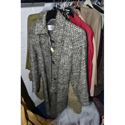 575 - A RAIL AND TWO BOXES OF LADIES CLOTHING, to include coats, jackets, faux furs, sheepskins, skirts an... 