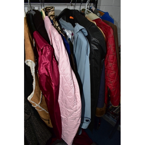 575 - A RAIL AND TWO BOXES OF LADIES CLOTHING, to include coats, jackets, faux furs, sheepskins, skirts an... 