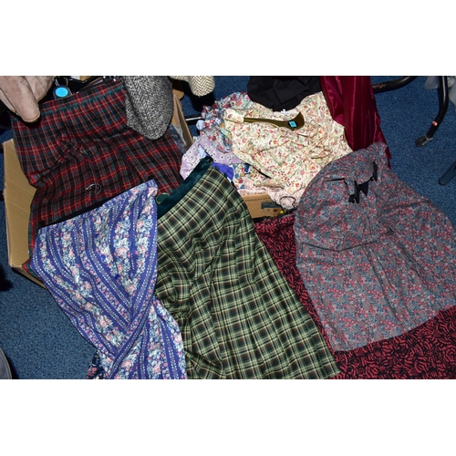 575 - A RAIL AND TWO BOXES OF LADIES CLOTHING, to include coats, jackets, faux furs, sheepskins, skirts an... 