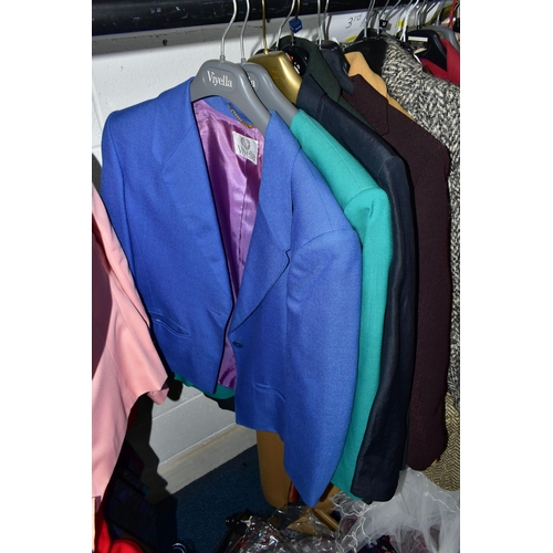 575 - A RAIL AND TWO BOXES OF LADIES CLOTHING, to include coats, jackets, faux furs, sheepskins, skirts an... 