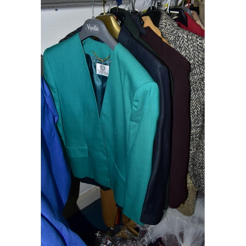 575 - A RAIL AND TWO BOXES OF LADIES CLOTHING, to include coats, jackets, faux furs, sheepskins, skirts an... 