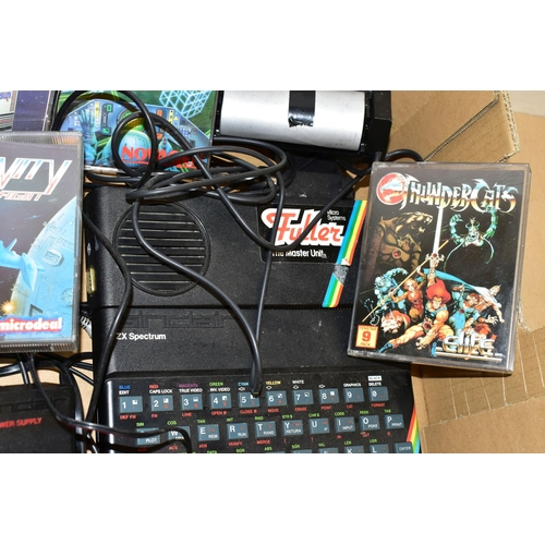 262 - THREE ZX SPECTRUM COMPUTERS AND A QUANTITY OF AMIGA GAMES, games include Wizball, The New Zealand St... 