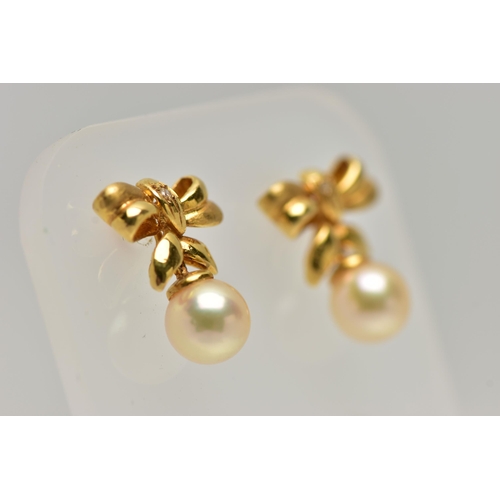 13 - A PAIR OF 18CT GOLD, CULTURED PEARL DROP EARRINGS, each earring designed as a bow set with a small r... 