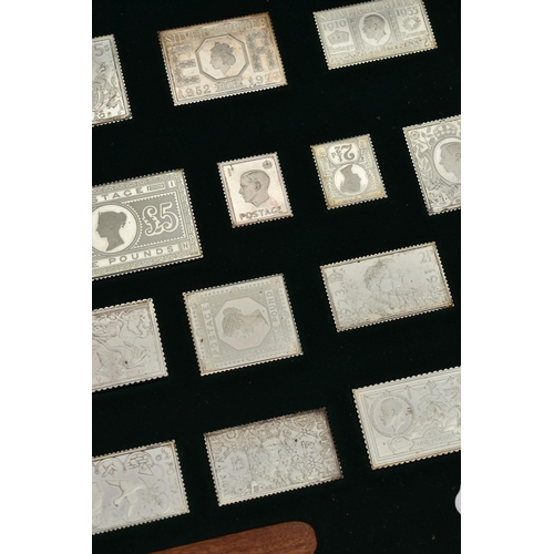 147 - A CASED SET OF SILVER STAMPS AND A BOX OF PIN BADGES, 'The Stamps of Royalty' silver stamp collectio... 