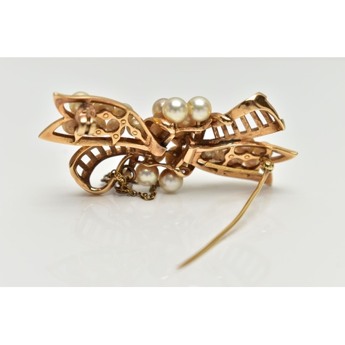 2 - A YELLOW METAL 'MIKIMOTO' CULTURED PEARL BOW BROOCH, openwork bow set with two rows of cultured pear... 