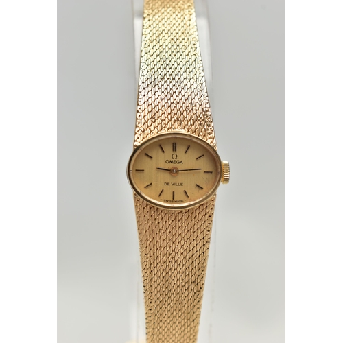 21 - A LADYS 9CT GOLD 'OMEGA' WRISTWATCH, manual wind, oval gold dial signed 'Omega De Ville', baton mark... 