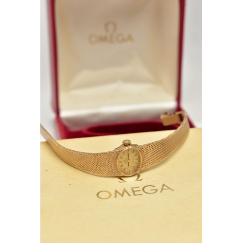 21 - A LADYS 9CT GOLD 'OMEGA' WRISTWATCH, manual wind, oval gold dial signed 'Omega De Ville', baton mark... 