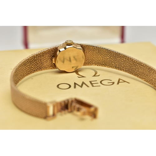 21 - A LADYS 9CT GOLD 'OMEGA' WRISTWATCH, manual wind, oval gold dial signed 'Omega De Ville', baton mark... 