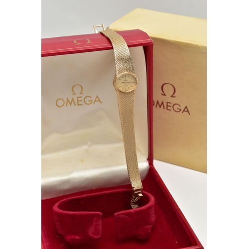 21 - A LADYS 9CT GOLD 'OMEGA' WRISTWATCH, manual wind, oval gold dial signed 'Omega De Ville', baton mark... 