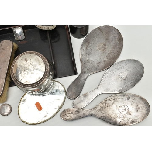 250 - A BOX OF SILVER BACKED AND SILVER MOUNTED DRESSING TABLE ITEMS, including a well used four piece Geo... 