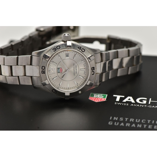 26 - A LADYS 'TAG HEUER' WRISTWATCH, quartz movement, round silver dial signed 'Tag Heuer, Aquaracer 300 ... 