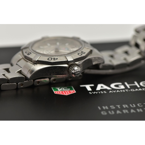 26 - A LADYS 'TAG HEUER' WRISTWATCH, quartz movement, round silver dial signed 'Tag Heuer, Aquaracer 300 ... 