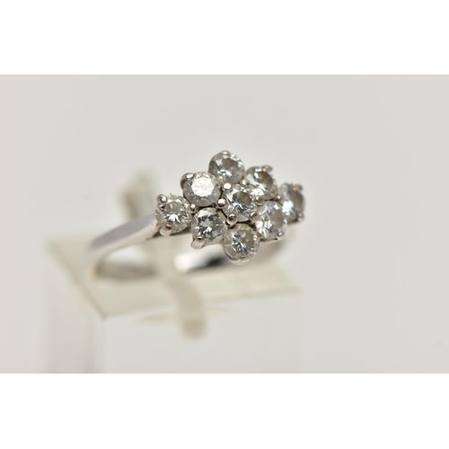 35 - AN 18CT WHITE GOLD DIAMOND CLUSTER RING, of a marquise outline, set with nine round brilliant cut di... 