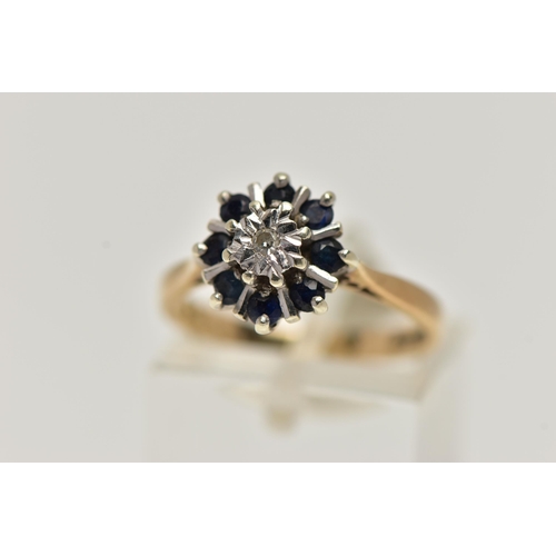 41 - A 9CT GOLD SAPPHIRE AND DIAMOND CLUSTER RING, centring on a single cut diamond illusion set, in a su... 