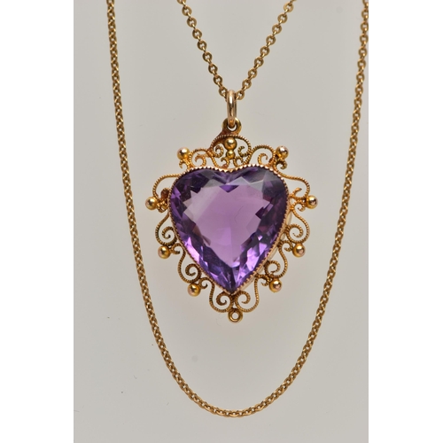 47 - A YELLOW METAL AMETHYST PENDANT NECKLACE, heart cut amethyst, milgrain collet set within a cannetill... 