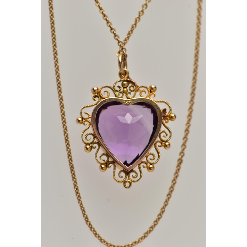 47 - A YELLOW METAL AMETHYST PENDANT NECKLACE, heart cut amethyst, milgrain collet set within a cannetill... 