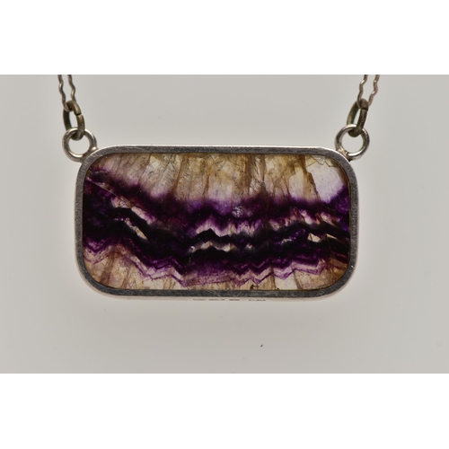 48 - A SILVER BLUE JOHN FLUORITE PENDANT, the blue john fluorite pendant of a rectangular form collet set... 