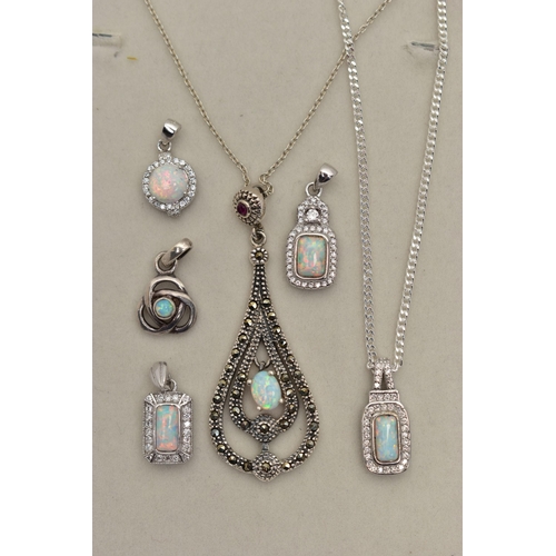 83 - TWO PENDANT NECKLACES AND FOUR PENDANTS, the first pendant of an openwork tear drop shape, set with ... 