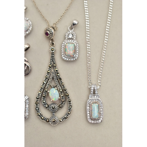 83 - TWO PENDANT NECKLACES AND FOUR PENDANTS, the first pendant of an openwork tear drop shape, set with ... 