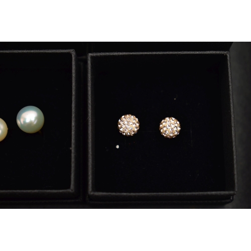 87 - A BOX OF ASSORTED EARRINGS, nine pairs in total, to include seven pairs of cultured pearl stud earri... 