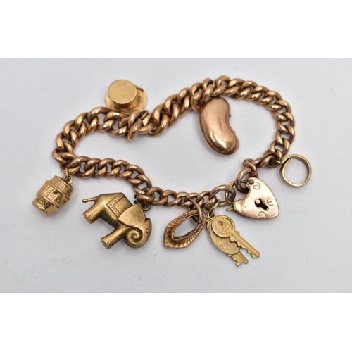 11 - A 9CT GOLD CHARM BRACELET, hollow curb link bracelet, each link stamped 9c, fitted with a heart padl... 