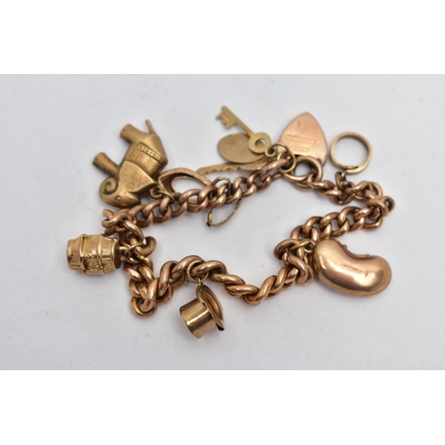 11 - A 9CT GOLD CHARM BRACELET, hollow curb link bracelet, each link stamped 9c, fitted with a heart padl... 