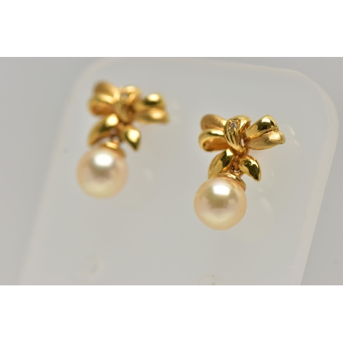 13 - A PAIR OF 18CT GOLD, CULTURED PEARL DROP EARRINGS, each earring designed as a bow set with a small r... 