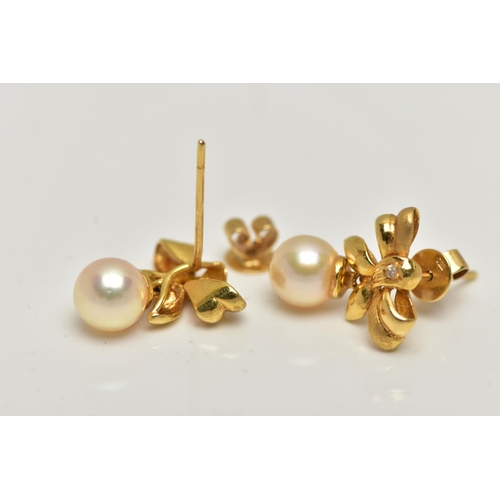 13 - A PAIR OF 18CT GOLD, CULTURED PEARL DROP EARRINGS, each earring designed as a bow set with a small r... 