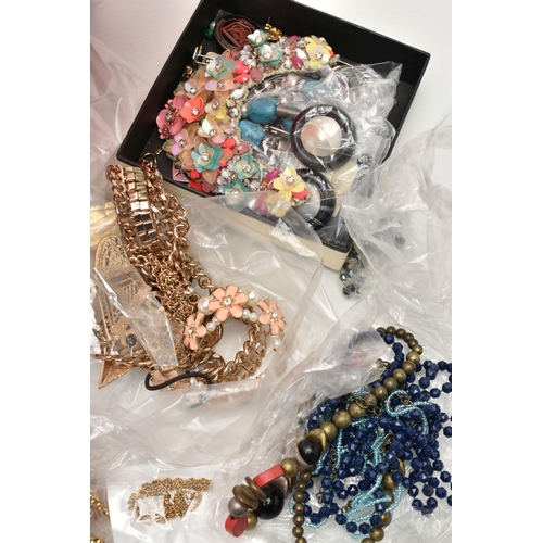 141 - A RED PLASTIC BOX OF ASSORTED COSTUME JEWELLERY AND ITEMS, to include various beaded necklaces, brac... 