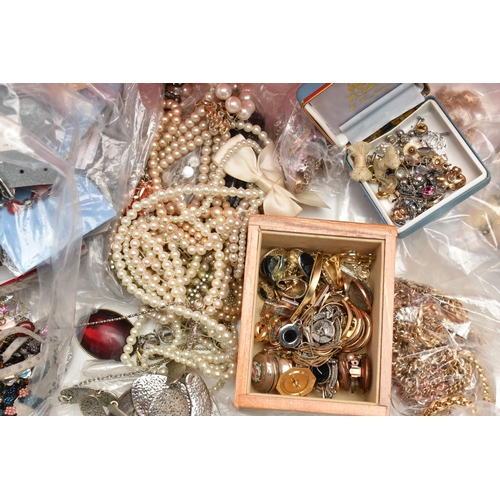 141 - A RED PLASTIC BOX OF ASSORTED COSTUME JEWELLERY AND ITEMS, to include various beaded necklaces, brac... 