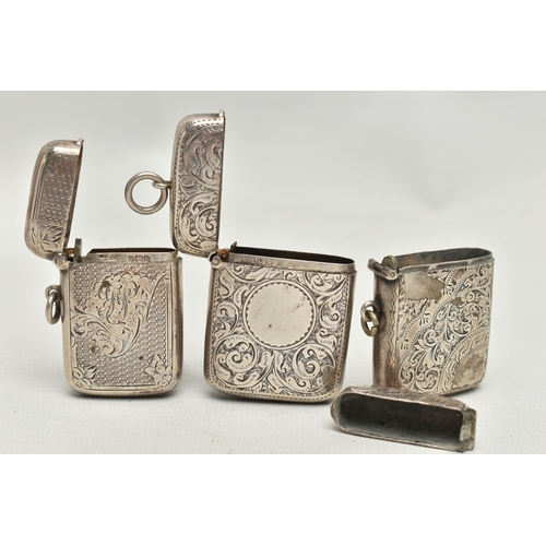 209 - THREE LATE VICTORIAN SILVER RECTANGULAR VESTA CASES, all engraved with foliate designs, the engine t... 