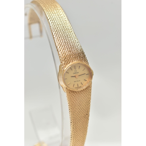 21 - A LADYS 9CT GOLD 'OMEGA' WRISTWATCH, manual wind, oval gold dial signed 'Omega De Ville', baton mark... 