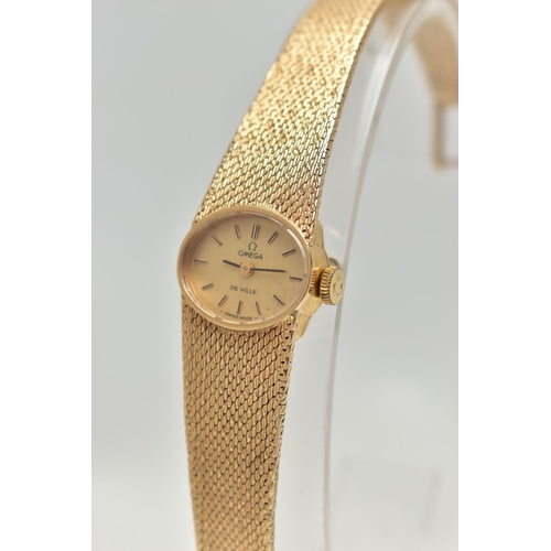 21 - A LADYS 9CT GOLD 'OMEGA' WRISTWATCH, manual wind, oval gold dial signed 'Omega De Ville', baton mark... 