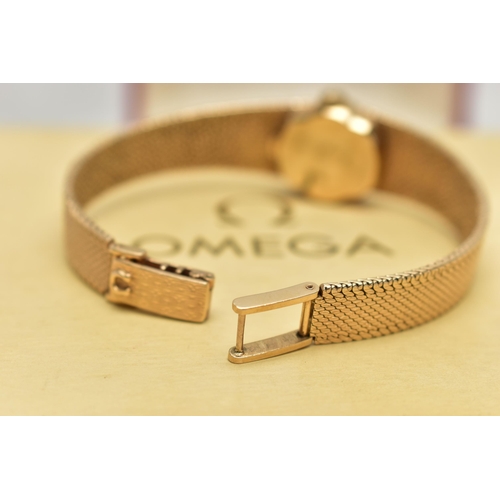 21 - A LADYS 9CT GOLD 'OMEGA' WRISTWATCH, manual wind, oval gold dial signed 'Omega De Ville', baton mark... 