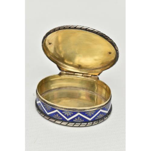 222 - A LATE 19TH CENTURY CONTINENTAL SILVER, ENAMEL AND PORCELAIN SNUFF BOX OF OVAL FORM, the hinged cove... 