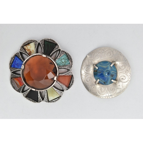 242 - TWO SECOND HALF 20TH CENTURY COSTUME JEWELLERY BROOCHES, both of circular form, Cairngorm and Celtic... 