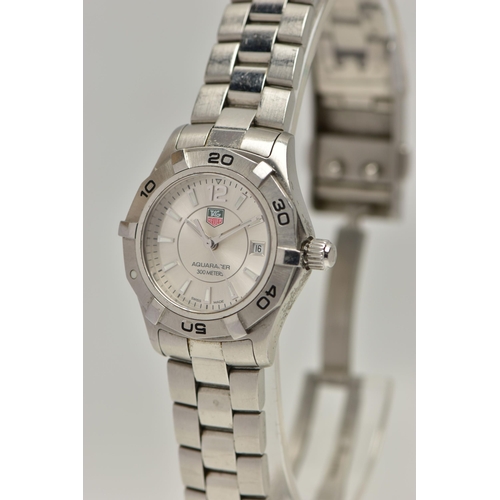 26 - A LADYS 'TAG HEUER' WRISTWATCH, quartz movement, round silver dial signed 'Tag Heuer, Aquaracer 300 ... 