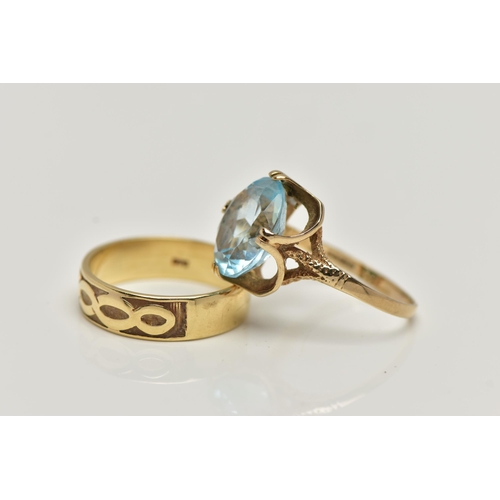 27 - TWO 9CT GOLD RINGS, the first designed with a double four claw set, oval cut light blue topaz, in an... 