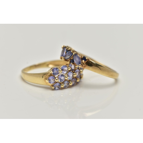 28 - TWO 9CT GOLD TANZANITE RINGS, the first designed with a row of three circular cut tanzanite, sixteen... 